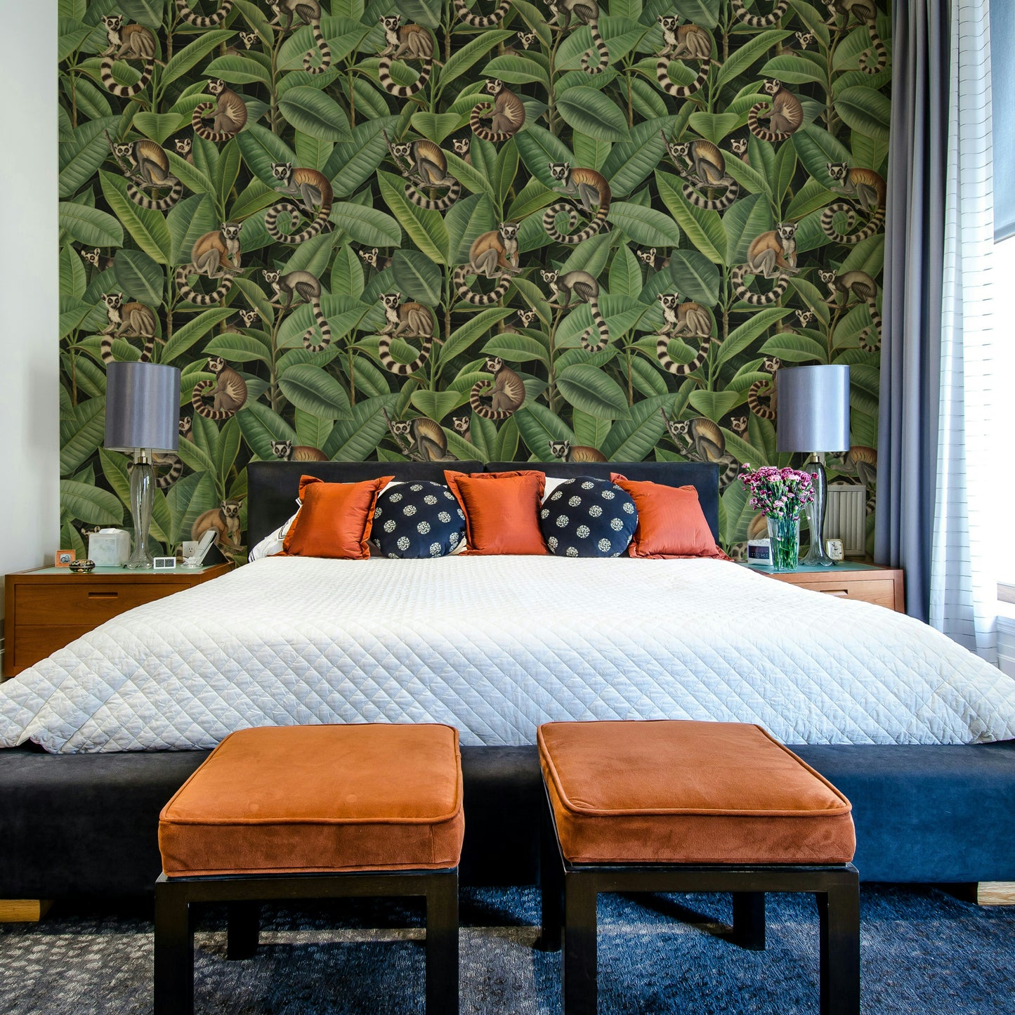 A wallpaper with a repeating pattern of ficus trees and monkeys.
