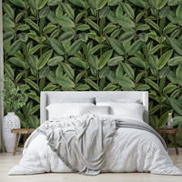 A wallpaper with a repeating pattern of rubber tree leaves and other tropical foliage.
