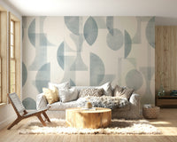 A bedroom decorated with a geometric mural

