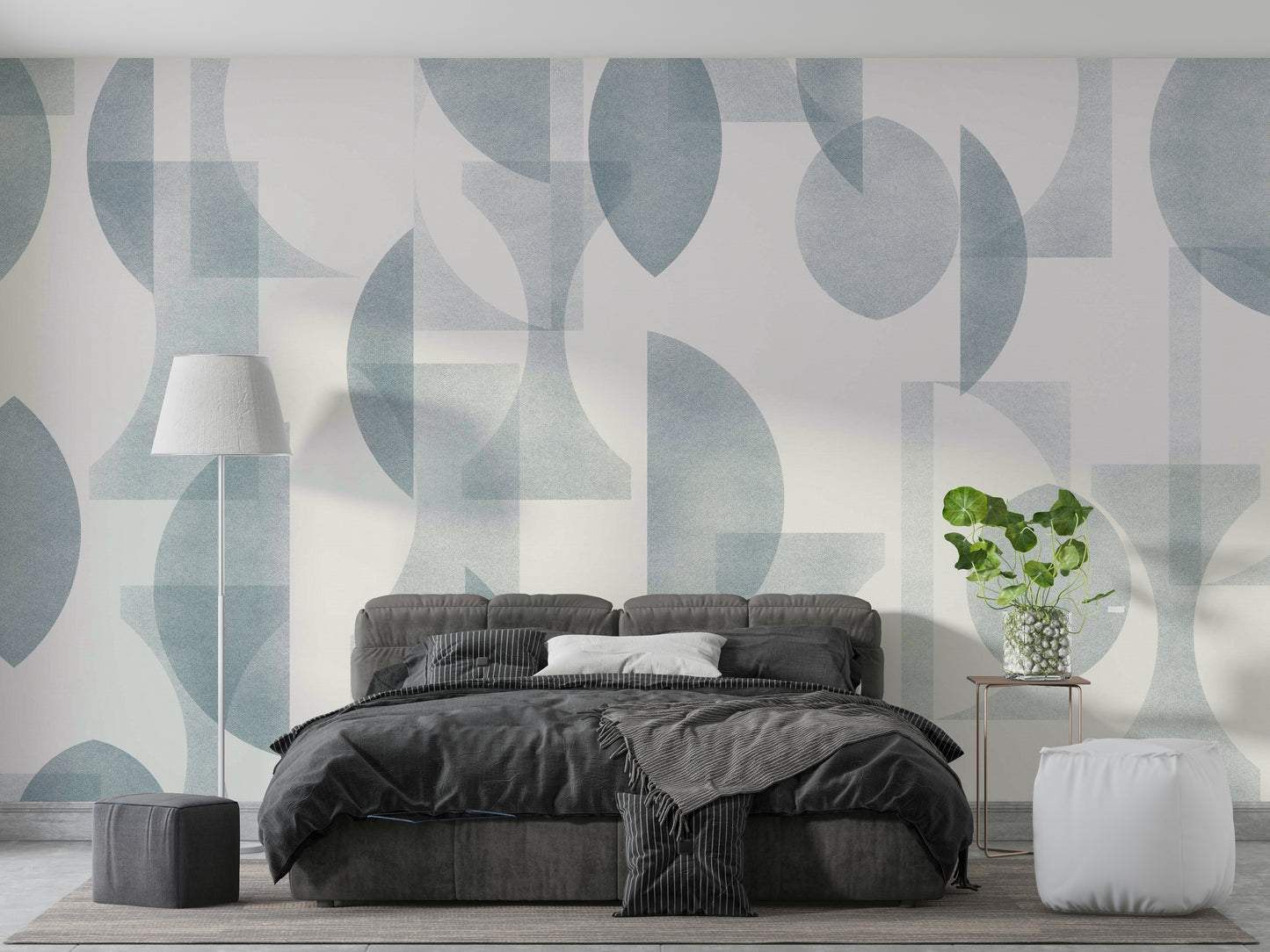 An angled shot of a wall with blue wallpaper

