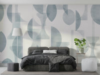 An angled shot of a wall with blue wallpaper

