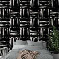 A full-wall mural showing a pattern of painted stripes.
