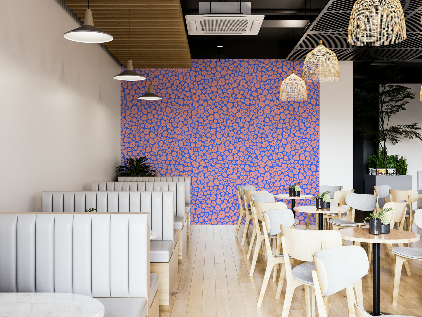 A full-wall mural showing a pattern of soft flowers.
