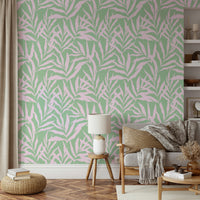 A living room with tropical palm leaf wallpaper

