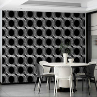 Wallpaper with a black and white repeating circles design

