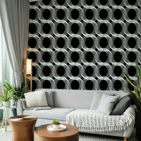 A modern living room with a geometric wall mural

