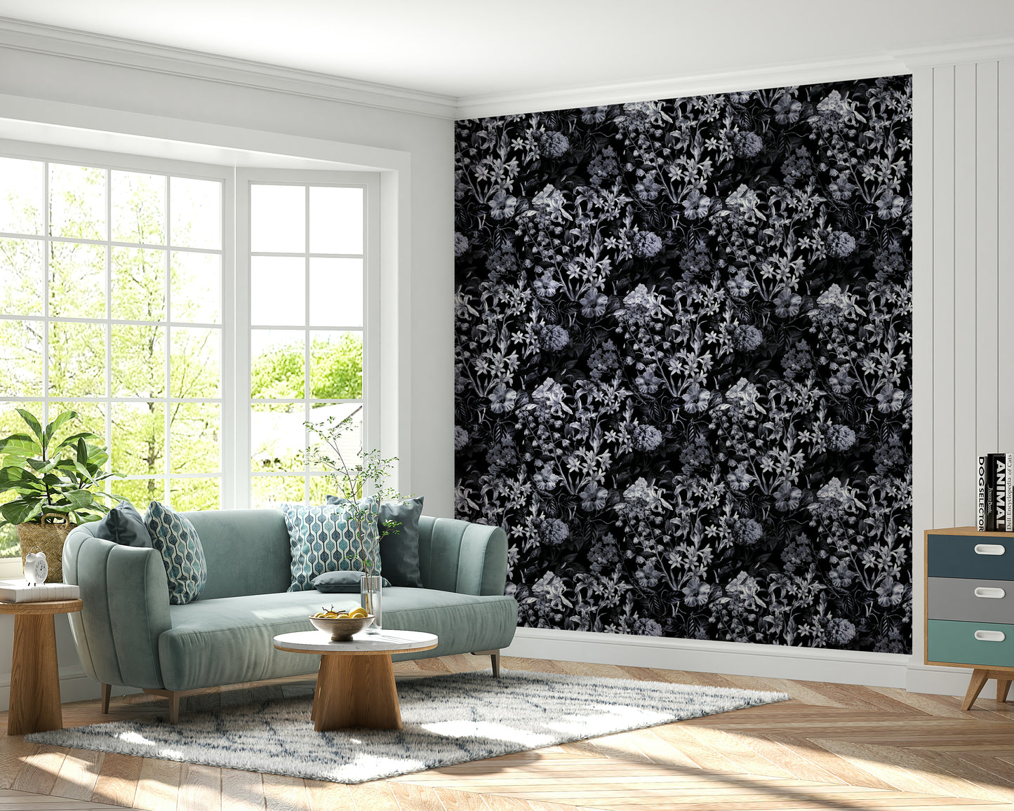 A dining room decorated with a dark floral mural

