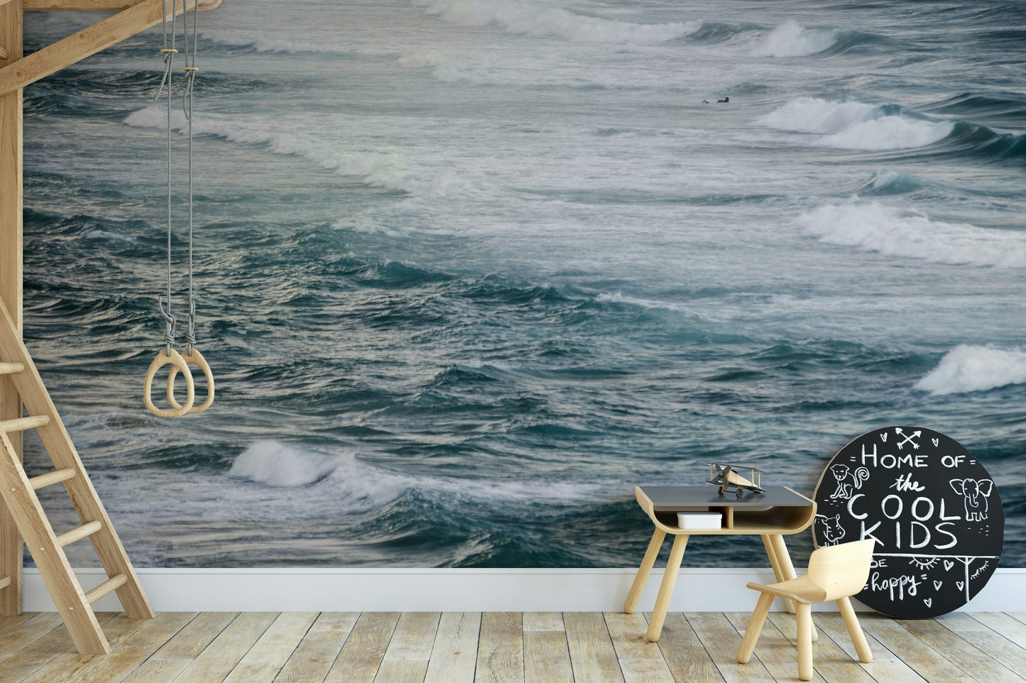 A living room with the winter surfing wall mural.

