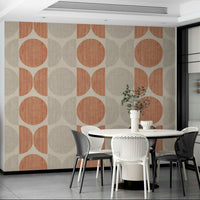 A graceful subtle circle wall mural in warm, orange tones.

