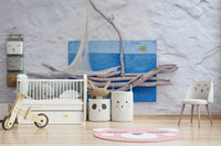 An artistic driftwood boat mural on minimalist wallpaper.

