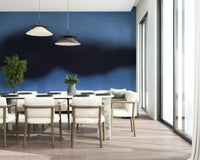 An artistic blue sky mural on minimalist wallpaper.

