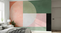 An artistic abstract shape mural on minimalist wallpaper.

