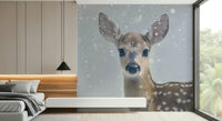Decorative wall mural showcasing a peaceful fawn surrounded by snow-covered trees.