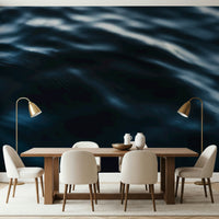 Decorative mural featuring flowing blue waves with natural highlights and shadows.