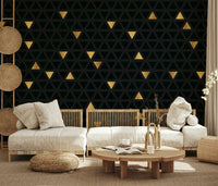 Angled view of the Luxury Black and Gold Triangles abstract wallpaper, highlighting the dynamic, repeating pattern.