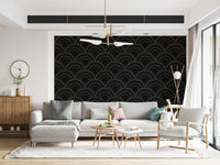 An angled view of the Black Charcoal Waves Wall Mural, emphasizing the sense of movement in its dark, wavy lines and geometric wallpaper design.
