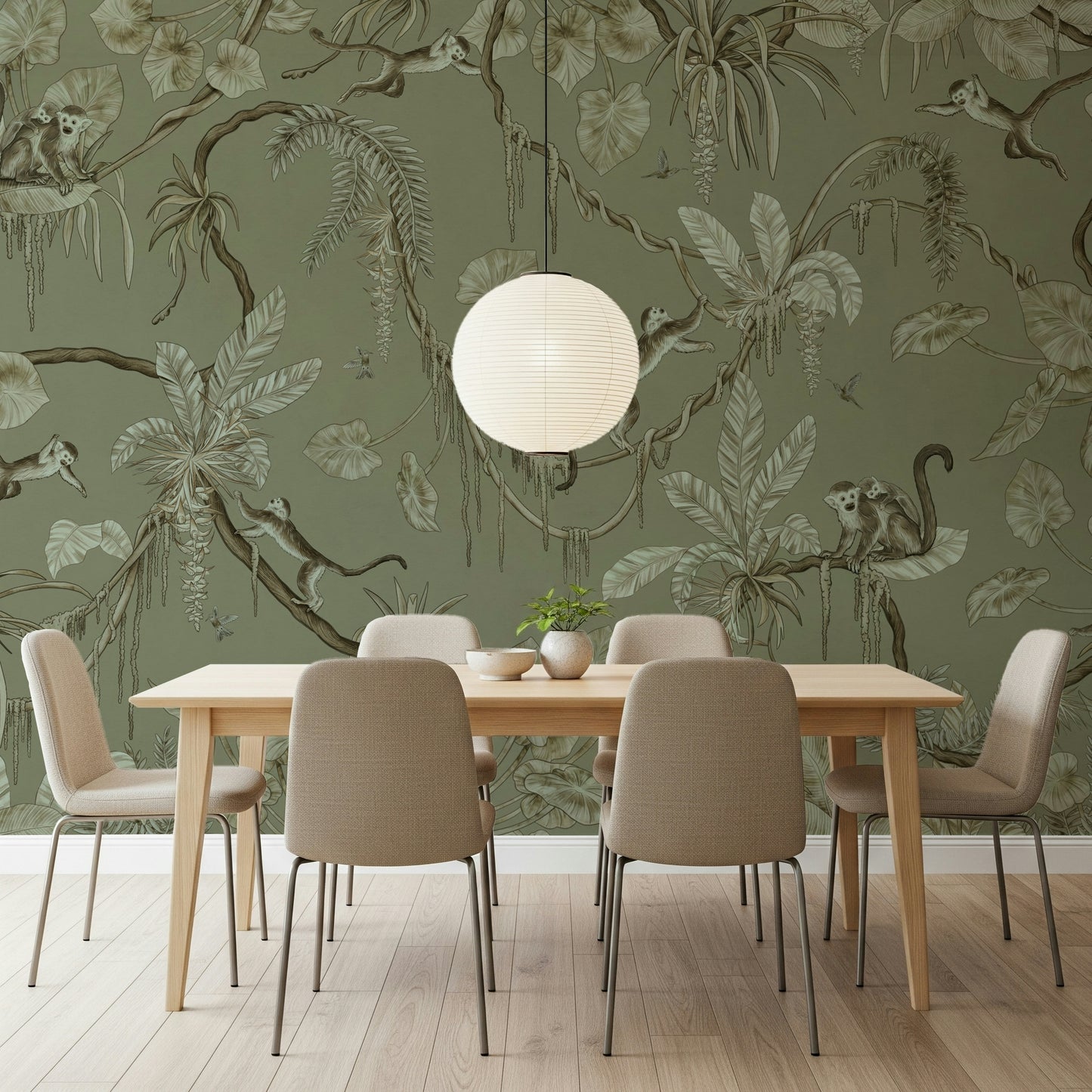 Nature-inspired wall art with monkeys perched on leafy jungle branches