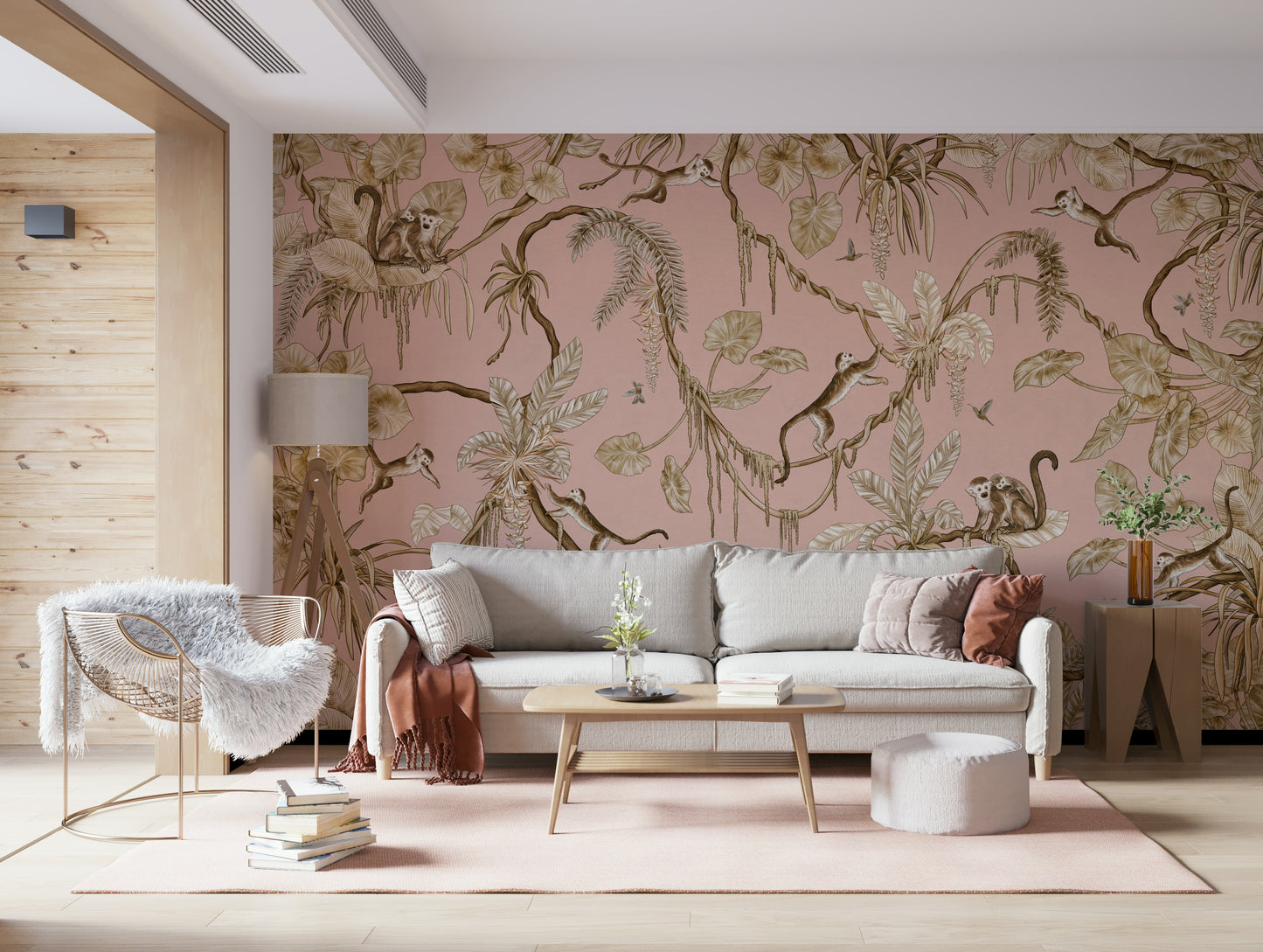 Charming jungle-inspired mural with monkeys in a soft pink tropical scene