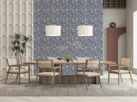 Soft gray wallpaper adorned with repeated foliage patterns for a natural feel.