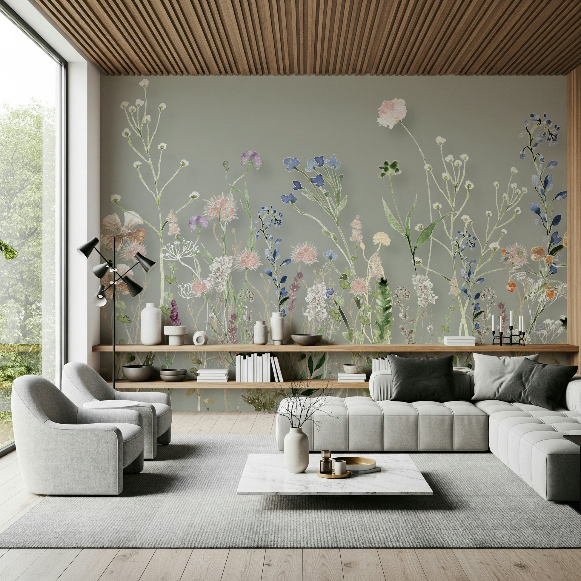 A floral wallpaper with hand-painted wildflowers rising gracefully from the bottom of the mural.