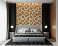 Modern abstract mural with glowing amber circles in varied sizes.