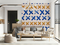 Expressive brushstroke crosses design adding movement and texture to walls.