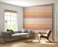 A minimal geometric wallpaper with irregular squares transitioning through warm earthy hues.