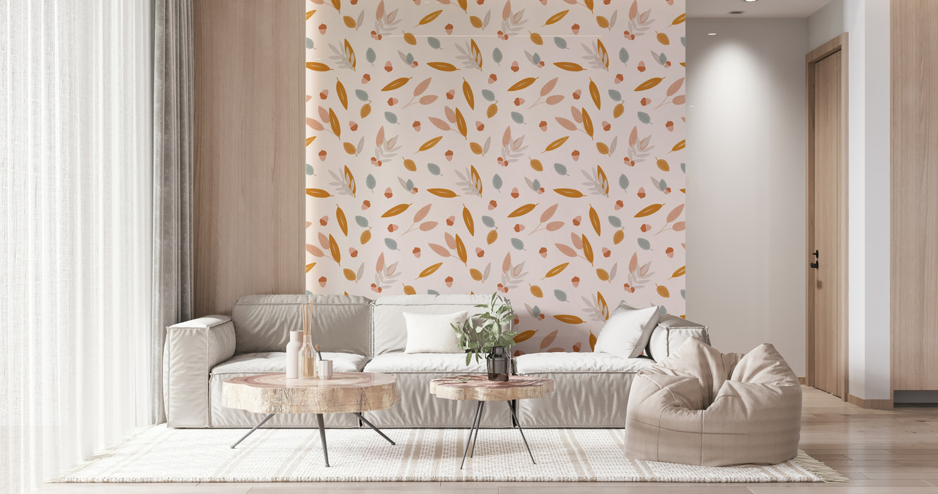 A soft autumn-inspired wallpaper featuring scattered acorns and delicate leaves in warm pastel tones.