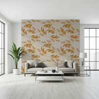 A minimalist leaf wallpaper with warm golden tones forming a subtle organic pattern.
