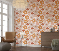 Soft boho flowers in terracotta and blush shades create a cozy vintage-style wallpaper design.