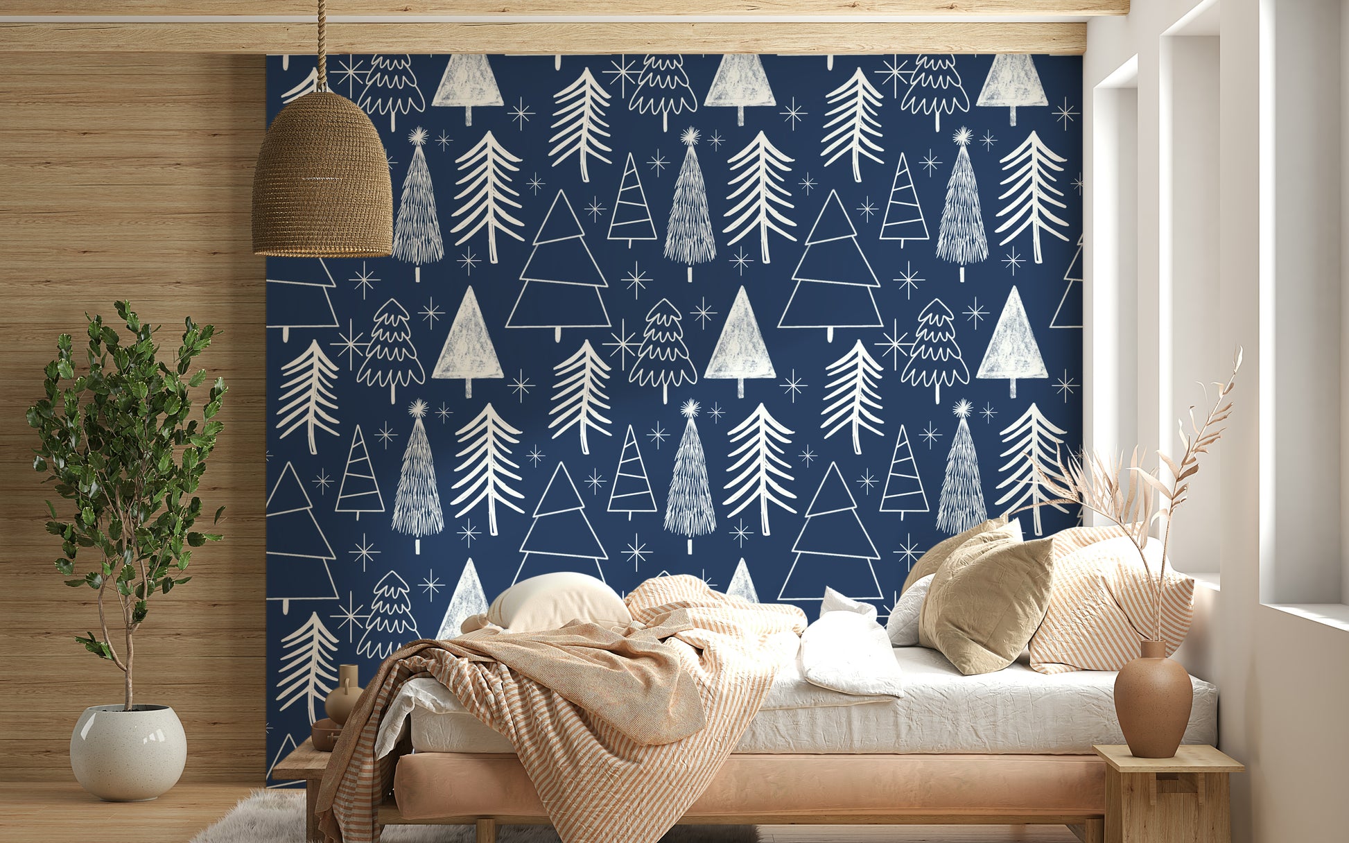 Minimalist tree illustrations and bright stars forming a festive pattern on navy wallpaper.