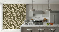 Modern vintage wallpaper with cream burst shapes scattered across an olive green design.
