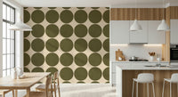 Simple geometric motif featuring earthy olive circles contrasted against a beige background
