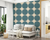 Minimalist teal circle pattern set against a warm beige background with a woven texture