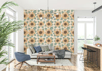 Nature-inspired wallpaper mural with detailed sunflower illustrations and soft teal foliage.