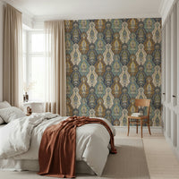 Artistic paisley wallpaper featuring textured floral and ornamental elements in a boho palette.