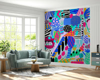 A cheerful wallpaper design full of multicolored blobs, lines, and patterns resembling party decorations.