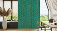 A patterned retro wallpaper with bright stylized leaves climbing neatly along turquoise stripes.