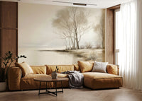 Delicate bare trees standing by a calm winter shore in a peaceful nature wallpaper.