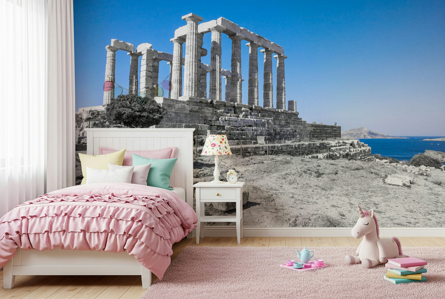 This wallpaper offers a panoramic view of the Poseidon Temple framed by clear blue skies and distant islands.