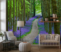 Woodland wallpaper featuring a tranquil path leading through fields of blooming bluebells.