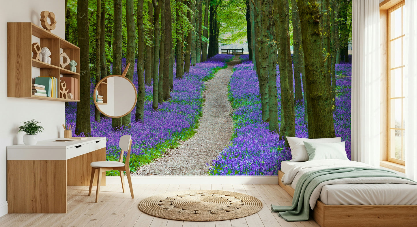 Scenic woodland wallpaper showcasing a winding trail bordered by blooming bluebells.