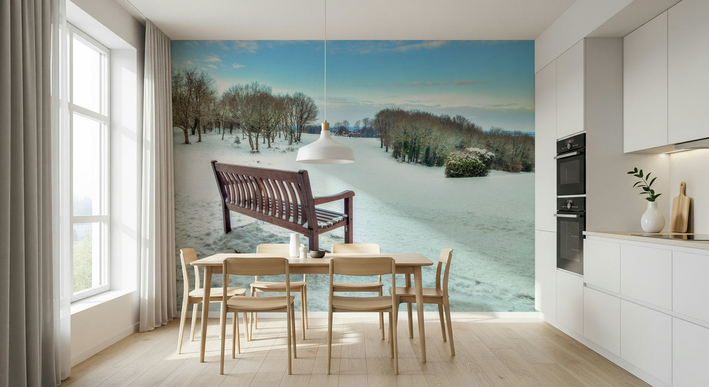 Vibrant winter forest mural, brown bench, calm Snowy Landscape wallpaper.