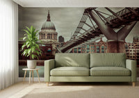Historic London architecture contrasts with modern bridge structure element.
