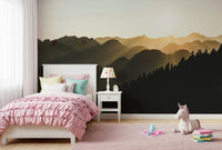 Wallpaper for homes showcasing an atmospheric mountain and woodland scene.