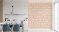 Coastal shell wallpaper adding detail to a relaxed dining room and kitchen 
