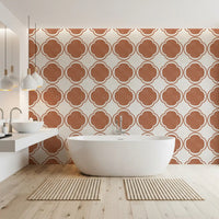 Quatrefoil terracotta wallpaper adding depth within an bathroom
