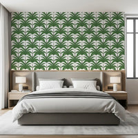 Geometric palm pattern wallpaper bringing natural vibes to a bedroom.
