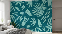 Botanical wall mural with layered leaf silhouettes and bold contrast