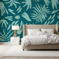 Botanical abstract wall mural in a bedroom with aqua leaf shapes